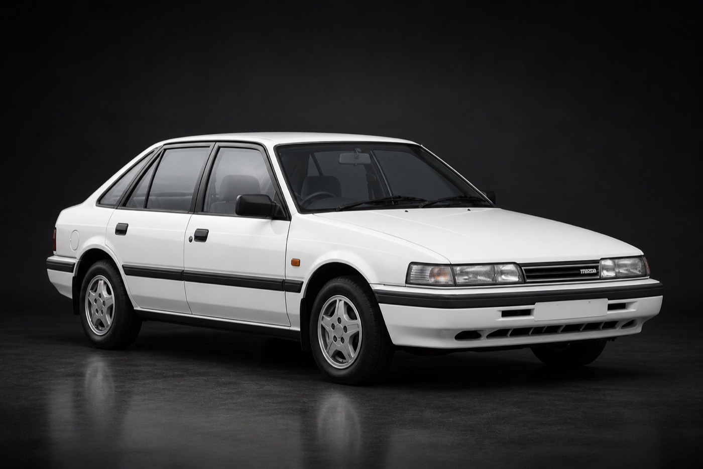 White Mazda 626 (GD) saloon in a dark photographic studio
