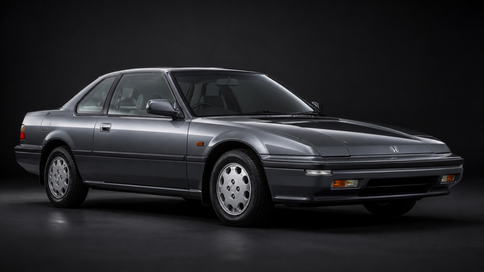 Metallic Grey Honda Prelude 2.0i-16 4WS in a dark photographic studio