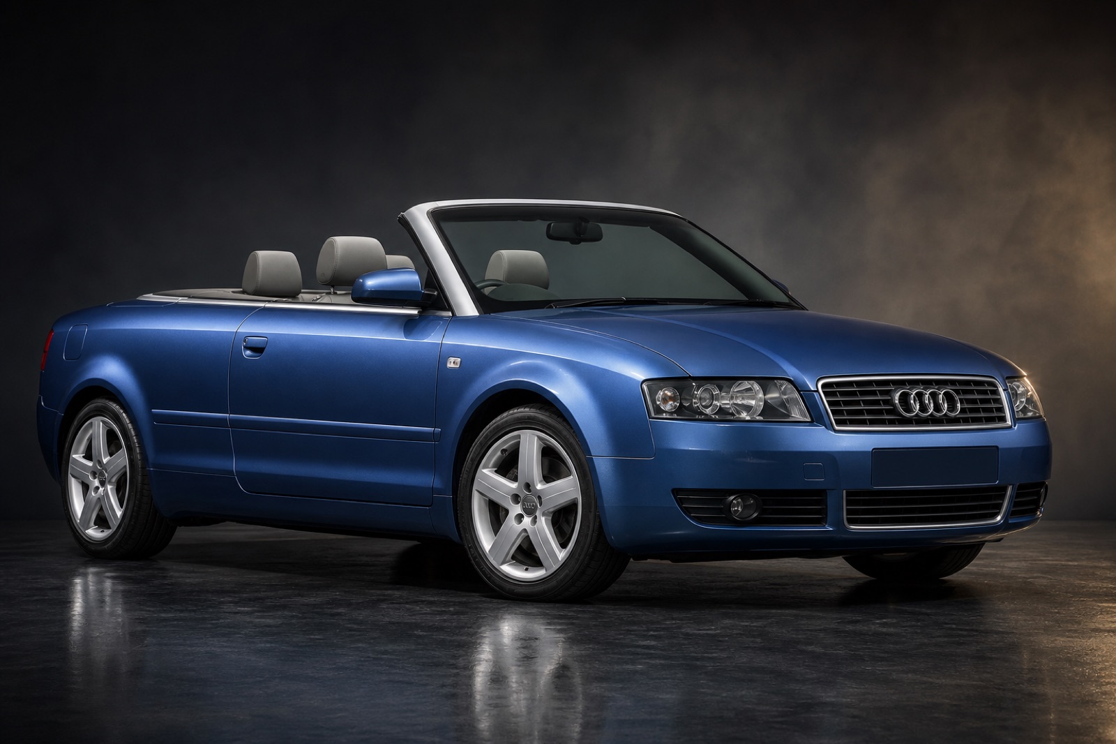 Blue Audi A4 Cabriolet in a dark photographic studio