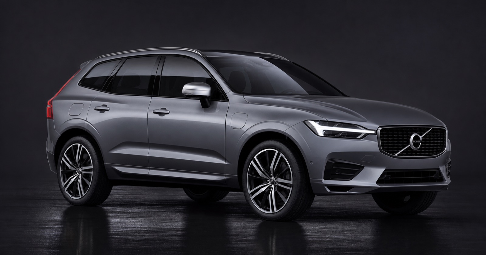 Osmium Grey Metallic, Charcoal contour sports leather/nubuck Volvo XC60 T8 Hybrid R-Design Pro in a dark photographic studio