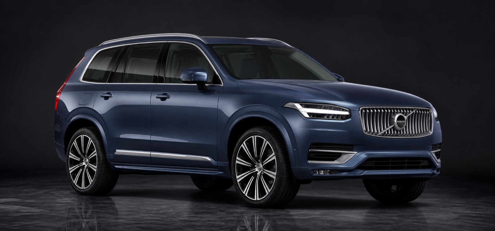 Dark Denim Blue, Charcoal ventilated nappa Volvo XC90 Recharge Ultimate T8 AWD in a dark photographic studio